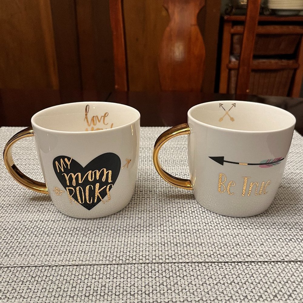 "My Mom Rocks" and "Be True" gold black mugs by SLANT